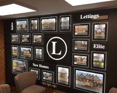 there are many pictures on the wall in this office building that says lettings, new homes, etc