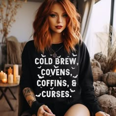 Witchy style Halloween sweatshirt, saying Cold Brew, Covens, Coffins, and Curses with little bats all around it, perfect for anytime of the year. For chilly summer evenings and warm winter layers, sweatshirts are a staple item all year round. The NuBlend® fleece is pre-shrunk, pull-resistant, and quarter-turned so it won't crease in the middle. Made from 50% polyester and 50% sustainably sourced USA cotton, they're very soft to the touch. .: 50% cotton, 50% polyester NuBlend® pre-shrunk fleece . Witchy Style, Winter Layers, Witchy Fashion, Makeup Clothes, Coffee Shirt, Fall Fits, Coffee Shirts, Fall Shirt, Halloween Sweatshirt