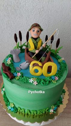 a birthday cake with a man fishing on the lake and an oar for 60