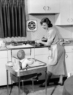 an old photo of a woman cooking with a baby in a highchair and the caption reads, soon your father will be home then mommy is going to get shitted on wine