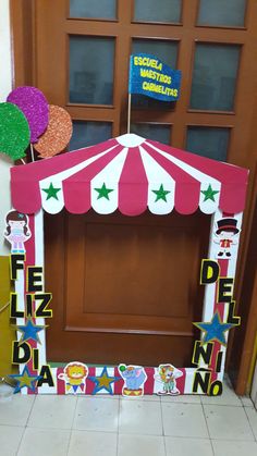 a carnival tent with decorations on the front door