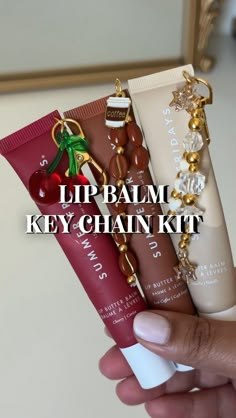 Lip Balm Key Chain Kit! You will receive: -key clasp and ring -2 ring links - 2ft of elastic thread -20-25 smaller beads  -Main Charm depending on which set you choose! (Cherry, strawberry cake, diamond stars, coffee cup) *LIP BALM NOT INCLUDED* *hole puncher also not included! Please use a thumbtack or safety pin to make the hole in the lip balm* Lip Balm Sets, Lip Balm Organization, How To Get Smaller Lips, Charms On Lip Gloss, Laneige Lip Balm Keychain, Summer Fridays Lip Balm Keychain, Lip Gloss With Charms, Lip Gloss Charm Diy, Lip Balm Charm Keychain