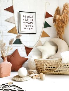 a white brick wall with some decorative items on the floor and in front of it