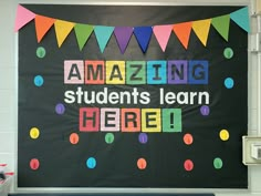 a classroom bulletin board with the words amazing students learn here written in bright colors on it