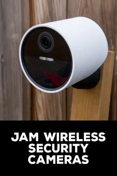 a security camera mounted to the side of a wooden fence with text that reads, jam wireless security cameras