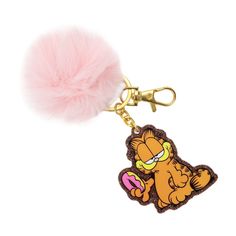 a pink pom - pom keychain with an image of garfield on it