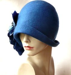 Blue Wool Hat For Winter, Vintage Blue Short Brim Hat, Blue Fedora Felt Hat For Winter, Blue Winter Fedora Felt Hat, Blue Fitted Wide Brim Cloche Hat, Brimmed Blue Mini Hats For Winter, Blue Wide Brim Cloche Hat, Vintage Blue Hat With Curved Brim, Blue Brimmed Hat For Winter