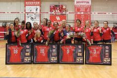 the volleyball team is posing with their trophies