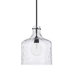 a clear glass light fixture with a black cord hanging from the ceiling, on an isolated white background