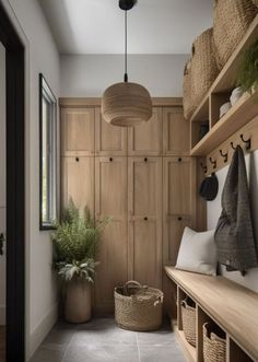 a hallway with wooden shelves and baskets on the wall, along with plants and hanging lights