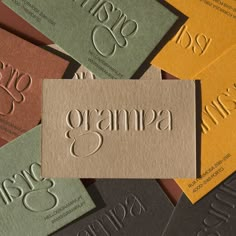 several business cards with the word gramma printed on them, all in different colors