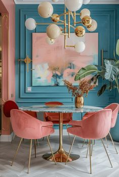 a dining room with blue walls and pink chairs