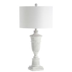 a white lamp with a white shade on it