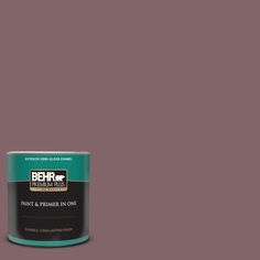 a can of behr paint on a teal blue background with the words behr written