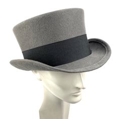 Bridgerton man top hat made of gray wool felt in short crown and embellished with a 50 milimeters wide black grosgrain ribbon. Edwardian topper wool felt hat ideal for everyday and special occasions such as weddings, cocktails or parties. For man and woman. You can make your hat with your favorite color by choosing it from my Wool felt color card. Measurements in centimeters are 32 x 27. Crown height 11. Brim length 6. These measurements may have some slight variation depending on the size of th Card Measurements, Black Top Hat, Crown Heights, Hat Man, Gray Top, Felt Hat, Grey Top, Hat Making, Top Hat