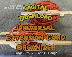 the digital universal extension cord organizer is made from wood and has an orange cord attached to it