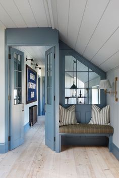 a room with blue walls and wooden floors