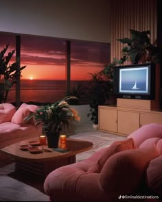 a living room filled with furniture and a flat screen tv