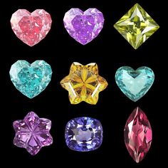 six different colored diamonds arranged in the shape of heart shaped shapes on a black background