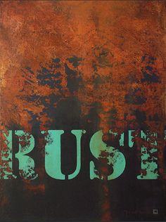 the word rust is painted on an orange and black background