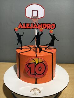 a birthday cake that is decorated to look like a basketball game