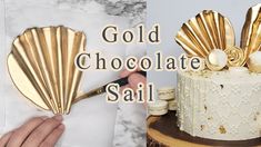 there is a cake with gold decorations on it and the words, gold chocolate sail