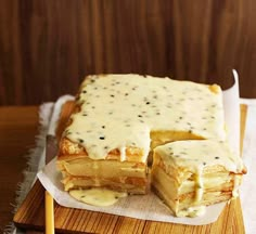 there is a pastry that has been cut in half on top of a cutting board