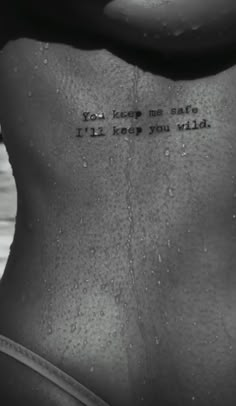 a woman's back with the words you keep me safe i'll keep you wild