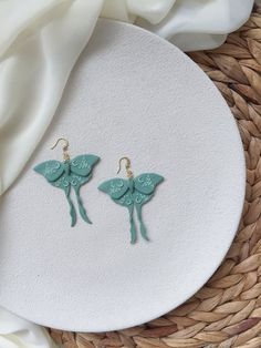 the earrings are made out of green clay