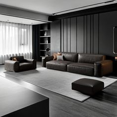 a black and white living room with leather furniture