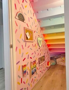 the wall is decorated with colorful sprinkles on it's walls and pictures