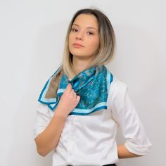 A pure silk scarf in a square cut, with a unique design that is handmade, in different colors so you can choose the one that fits you. SIZE 70 centimetres by 70 centimetres WEIGHT 26gr FABRIC Each scarf is made with pure silk crepe satin, with 12mm thickness COLOR Colours may appear different in the photo because of camera angles or shadows. Primary colour: Blue HOW TO CARE FOR YOUR SCARF Submerge in lukewarm water with liquid soap  Leave to dry in shadowy place Iron damp with a hot iron Any que Trendy Green Silk Scarf Gift, Elegant Silk Square Scarves, Chic Rectangular Silk Scarf As A Gift, Chic Rectangular Silk Scarf For Gifts, Trendy Green Scarf For Gift, Trendy Blue Scarf As Gift, Trendy Blue Scarf For Gift, Elegant Rectangular Silk Scarf For Gifts, Trendy Green Scarves For Gifts