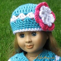 a doll is wearing a crocheted hat with a flower on the front and side