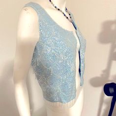 New! Gorgeous! Shimmery Light Blue Sequins & Beaded Sparkly Designer Zip Up Top. Hanging Beaded Fringe Along Bottom & Throughout Top. Artisan Handmade - Unique Piece! Vintage Unique Sparkly Light-Catching Sleeveless Top Can Be Worn Unzipped As Vest Or Blouse Front Zip With Hook Eye Closure At Top . Great For Parties , Weddings, Dressy Occasion Or Just To Look Smashing! Size 6 Unknown Designer - Artisan Very Special *Smoke-Free Home Excellent Condition - Never Worn ! *I’m A Fast Shipper *I’m A 5 Fitted Beaded Vest For Spring, Spring Fitted Beaded Vest, Spring Beaded Fitted Vest, Fitted Blue Vest For Party, Blue Embellished Sleeveless Top, Fitted Embellished Vest, Elegant Sequined Vest For Spring, Elegant Blue Vest For Party, Sequined Fitted Vest For Spring