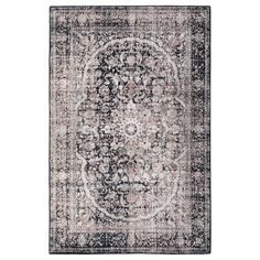 an area rug with a medallion design on the center in grey and pink tones,