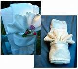 two pictures of towels and flowers sitting on a blue cloth covered chair with the covers folded down