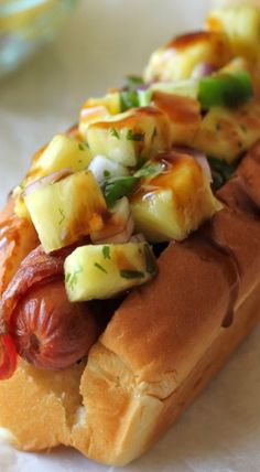 a hot dog on a bun with toppings