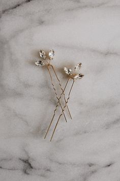 Our Petite Nora bridal hair pins features three delicate crystal rhinestone buds strung on dainty hair pins. These pins look gorgeous on their own, or as a pair or trio. The perfect accent for any bridal hairstyle. Tuck them behind your ear or style them in an undo.  These petite pins are available in gold and silver. Price is for a set of three hair pins. Each order is thoughtfully gift wrapped and shipped in a gold embossed Luna + Stone branded keepsake box. These boxes are perfect for gifting Wedding Hairdos, Bridal Hairpieces, Boho Hair Pins, Gold Hair Comb Wedding, Vine Jewelry, Hair Pins Wedding, Hair Tuck, Silver Hair Pin, Gold Hair Pin