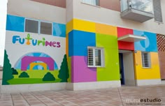 a multicolored building with the words futurines painted on it