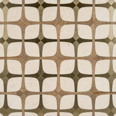 an abstract pattern made up of white and brown squares on top of eachother