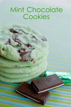 mint chocolate cookies stacked on top of each other next to a stack of candy bars