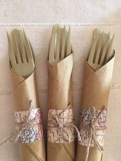 four forks wrapped in brown paper and tied with twine on top of each other