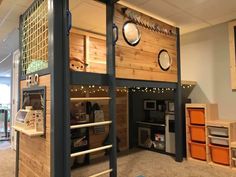 there is a loft bed made out of wood and has lights on the top bunk