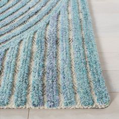 a blue and white rug on the floor