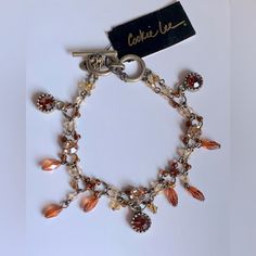 Genuine Crystal Antique Gold Tone Adjustable Double Stranded Beaded Dangle Toggle Bracelet By Cookie Lee * Nwt * Amber, Orange Tones * Rhodium Plated * Adjustable Toggle * Open Length: 8” Bundle & Save On Shipping And The More You Treat Yourself The Bigger The Discount You Will Receive! Ask Me Any Questions. I Want You To Be 100% Satisfied! Packaged With Care Just For You Fast Shipping Thank You For Visiting My Closet. Please Come Back Again Soon. Adjustable Orange Beaded Bracelet With Lobster Clasp, Amber Beaded Bracelets, Vintage Beaded Bracelets For Jewelry Making, Elegant Orange Metal Bracelets, Elegant Orange Metal Bracelet, Orange Beaded Bracelets, Travel Charm Bracelet, Cookie Lee Jewelry, Holiday Bracelets