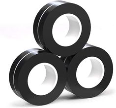 three black rings stacked on top of each other in front of a white background,