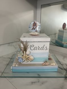 there is a cake that has been made to look like an ocean themed card box