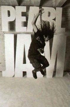 a person jumping in the air on a skateboard with words behind them that read live jam