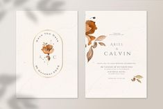 two wedding cards with watercolor flowers on them, one in gold and the other in white