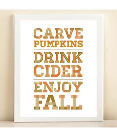 a white framed print with the words carve pumpkins drink cider enjoy fall